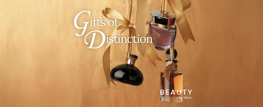 A gold banner with hanging gold ribbons holding up perfume bottles in the middle with a "Gifts of Distinction" title. 