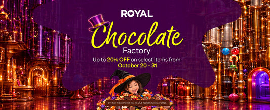 A banner featuring a candy factory and a girl in a witch costume on top of a mound of candies, with a purple splash and promotional text about the Royal Chocolate Factory sale from October 20 to 31.